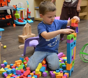 Boy playing with building blocks