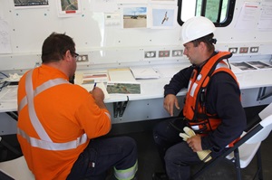 Safety workers in a trailer