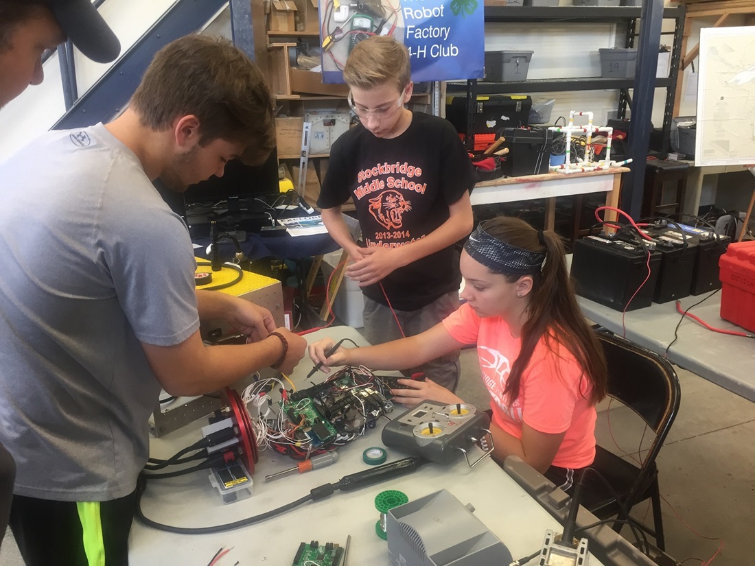 Students building remote operating vehicle