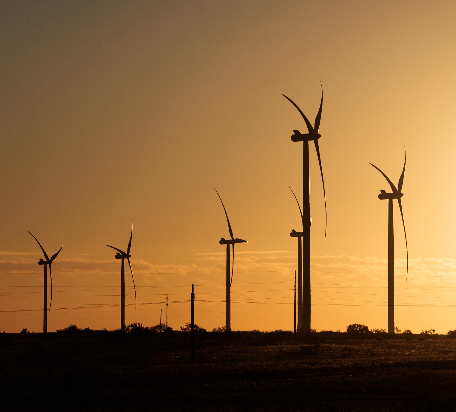 Wind turbines at sunset