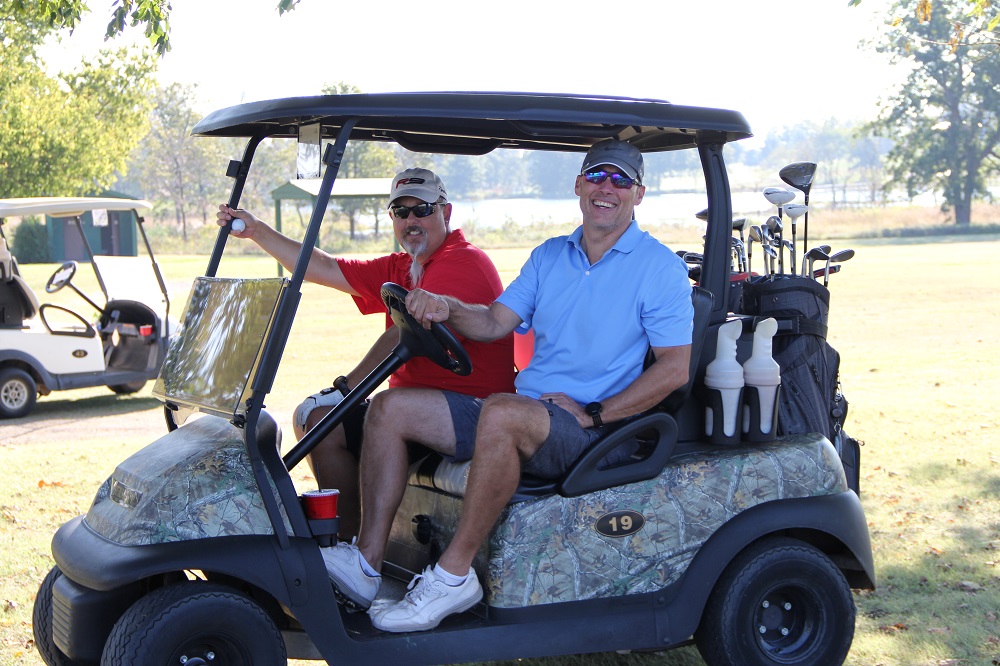 People in golf cart