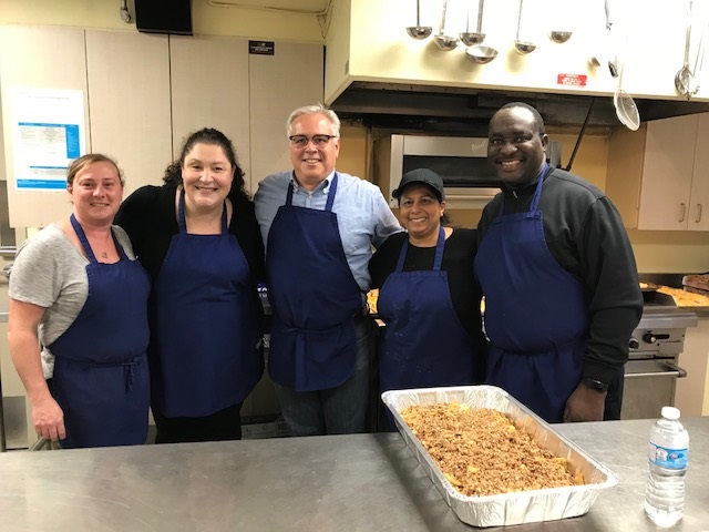 Volunteers cooking lunch