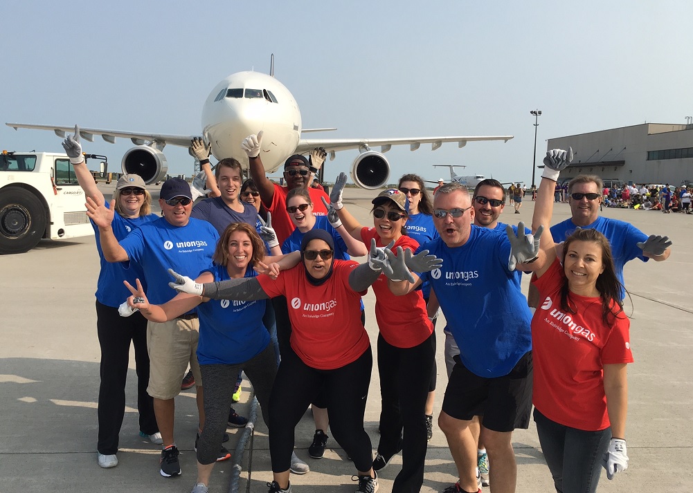Employees at plane pulling event