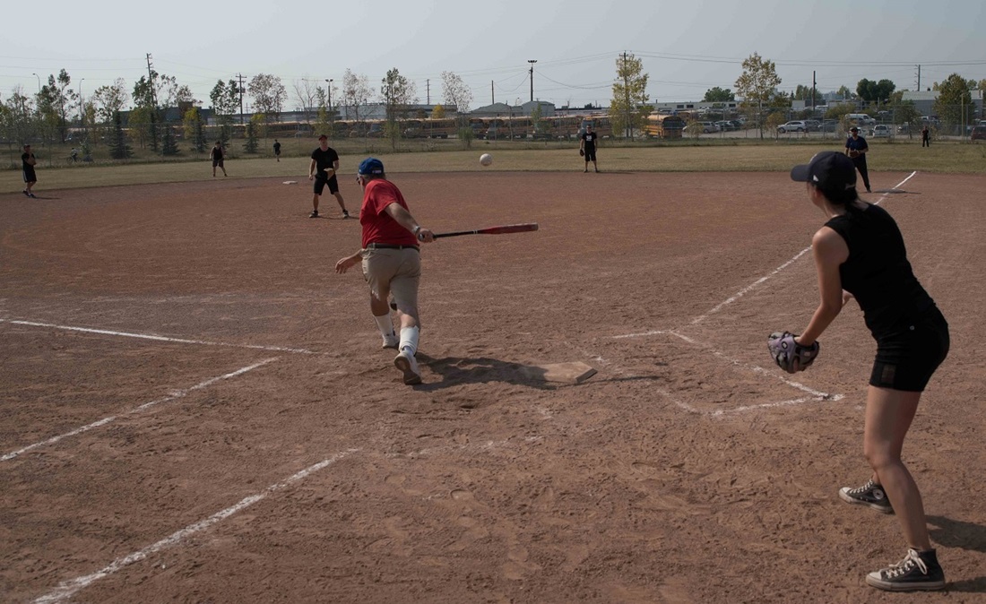 People playing softball