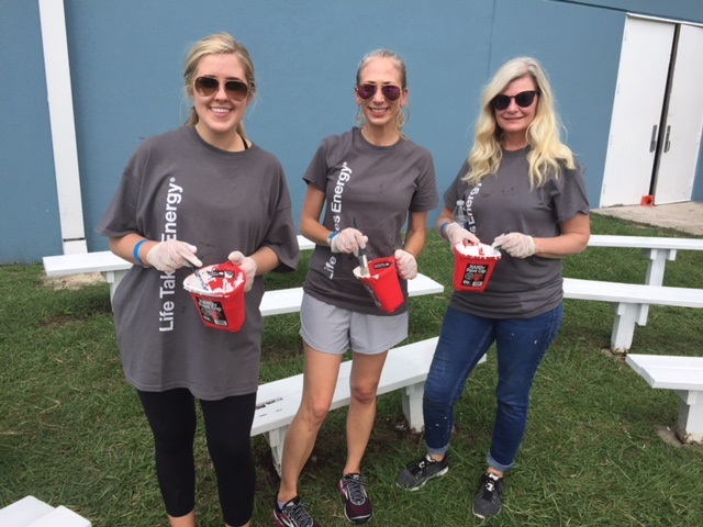 Volunteers painting a community center