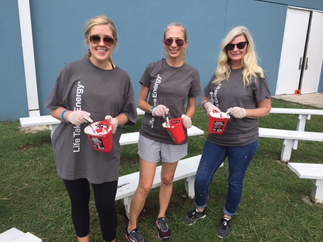 Volunteers painting a community center