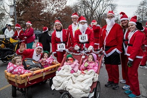 People dressed as Santa Claus for fun run