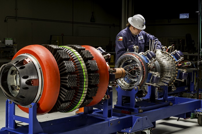 Worker examining Pipeline inspection tool