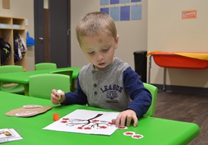 Small child doing arts and crafts