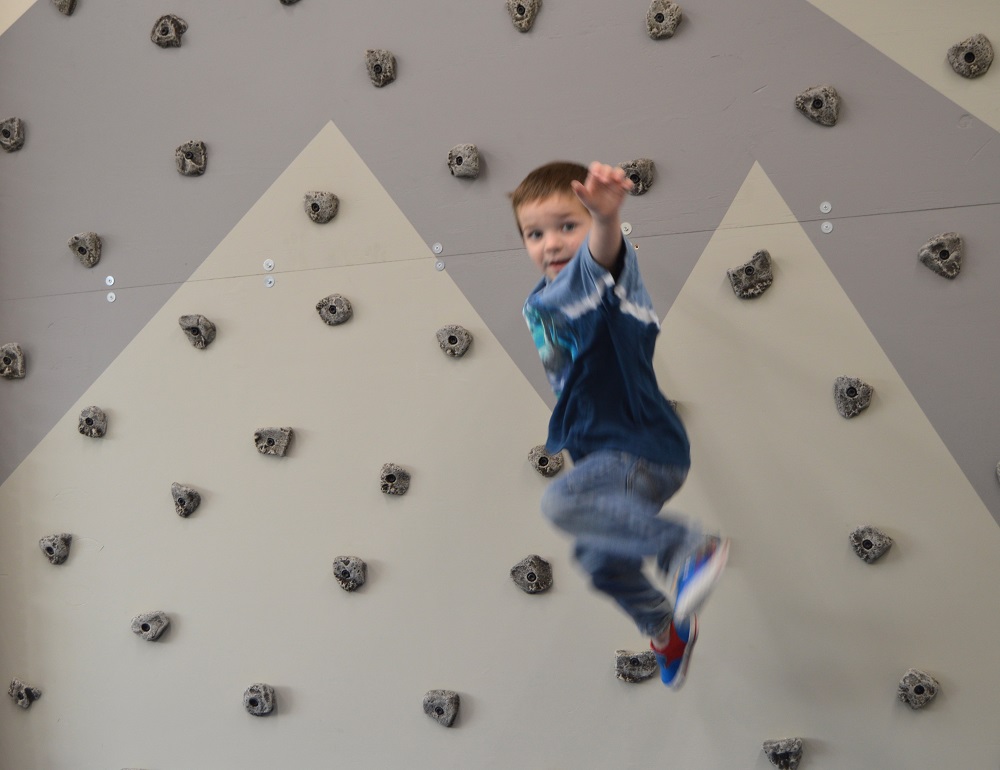 Boy on climbing wall