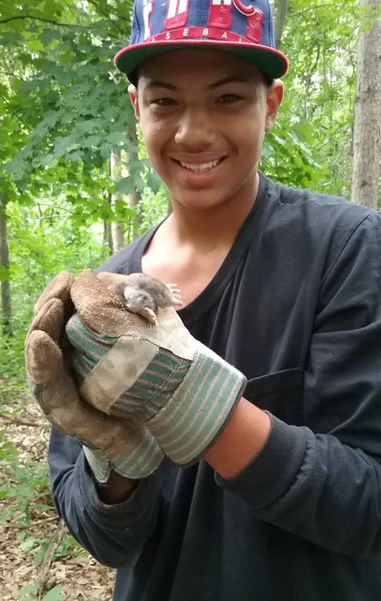 Camper wearing work gloves