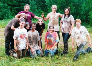 Campers wearing dirty clothes after cleanup work