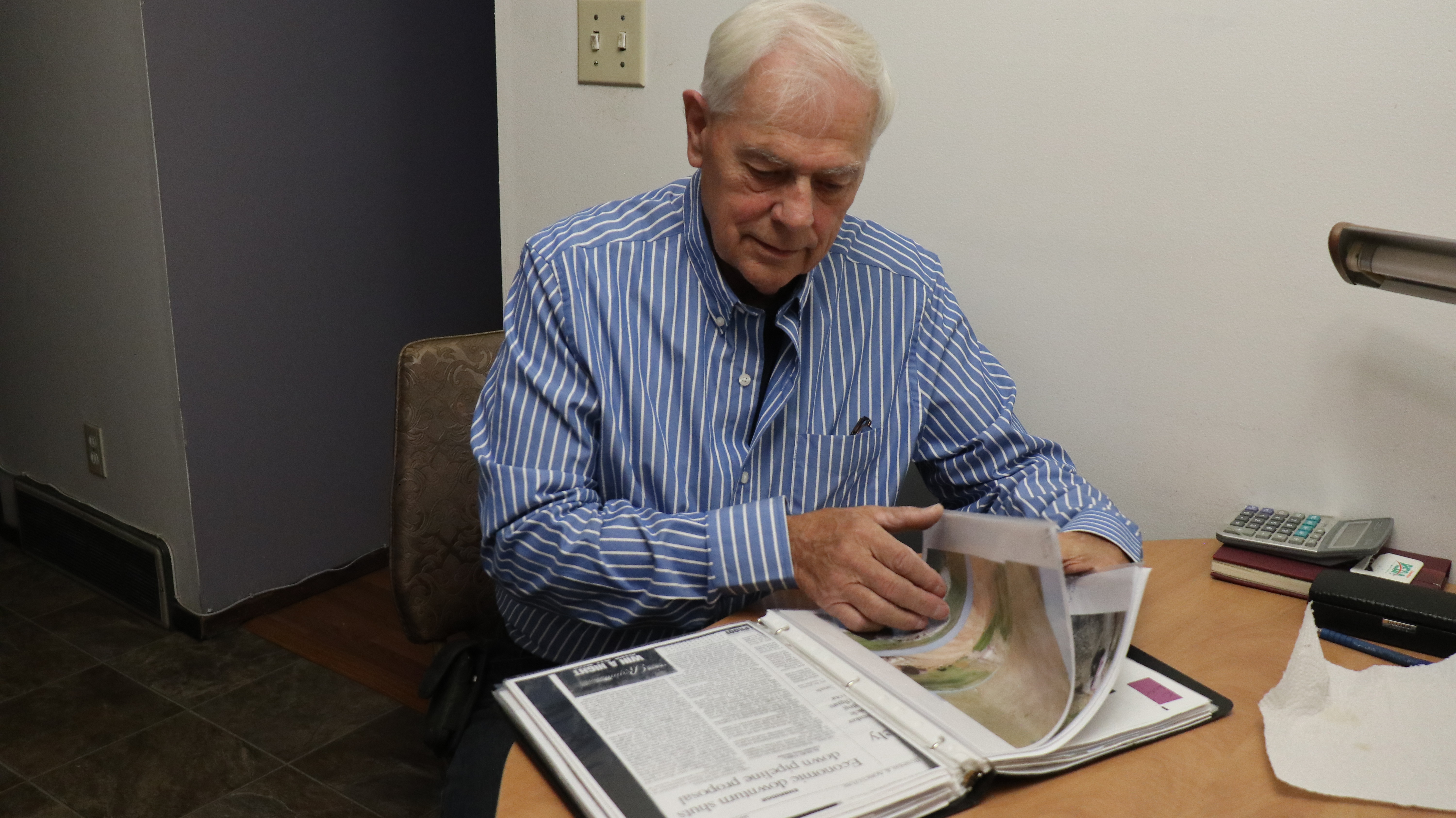 Raymond Bakken with pipeline scrapbook