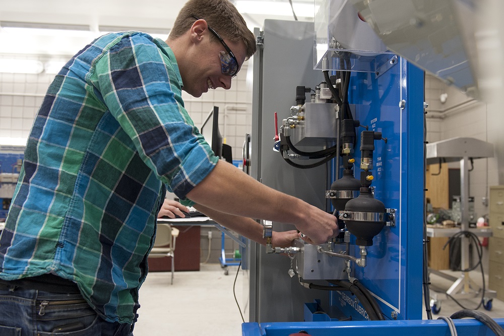 Student working on small generator