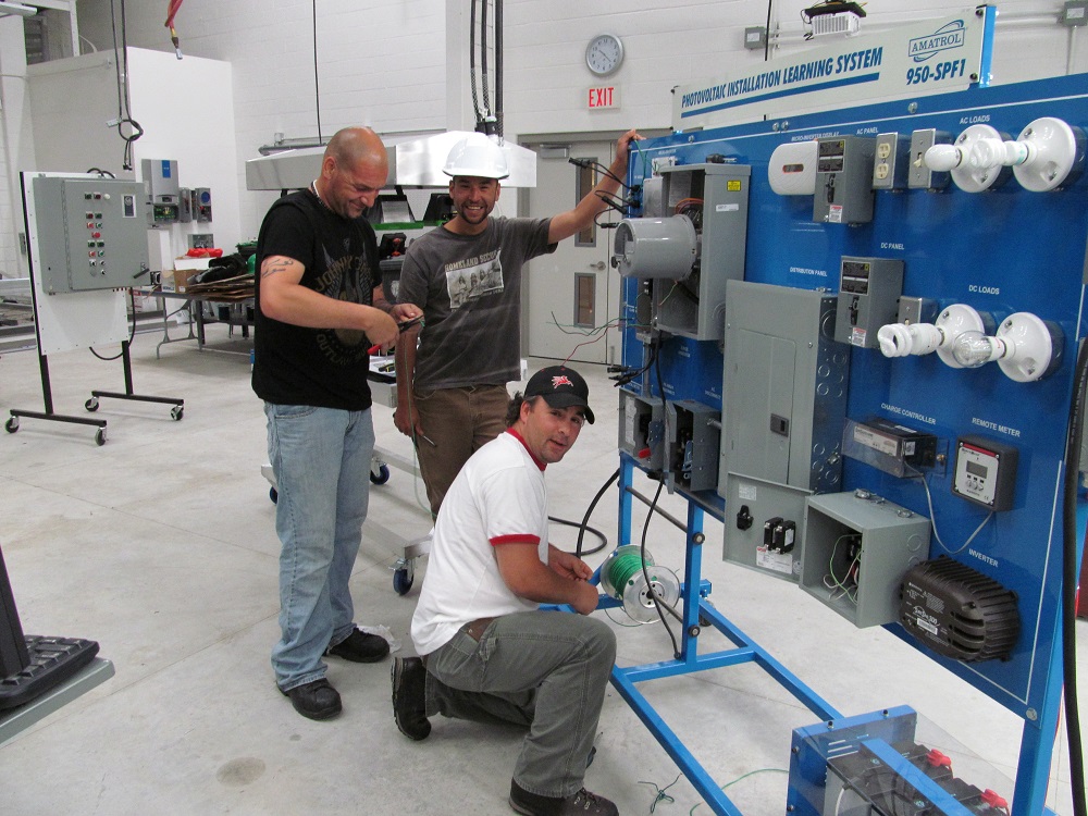 Students work on wiring in college lab