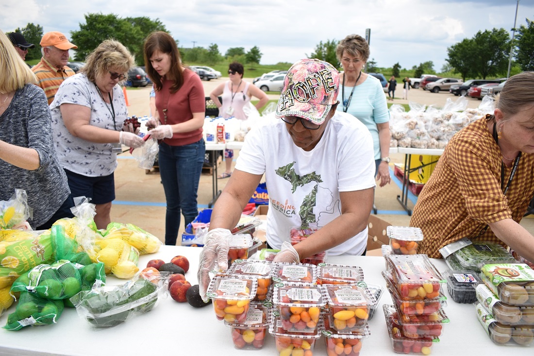 Food bank volunteer sorts food