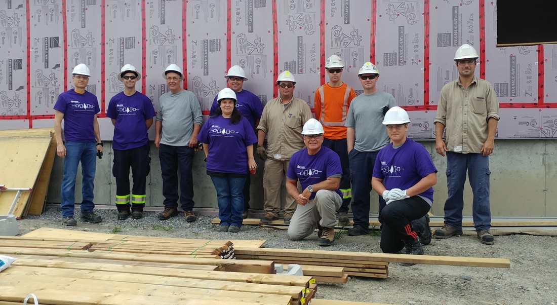 Volunteers building a home