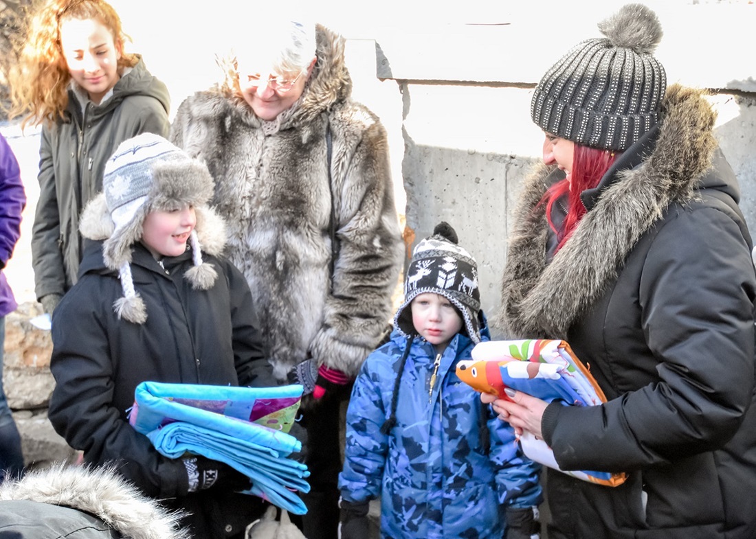 Woman and children wearing winter coats