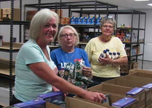 Three women at food bank