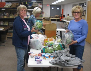 Women making food hampers