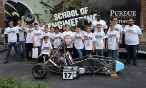 engineering summer camp students with small car they built