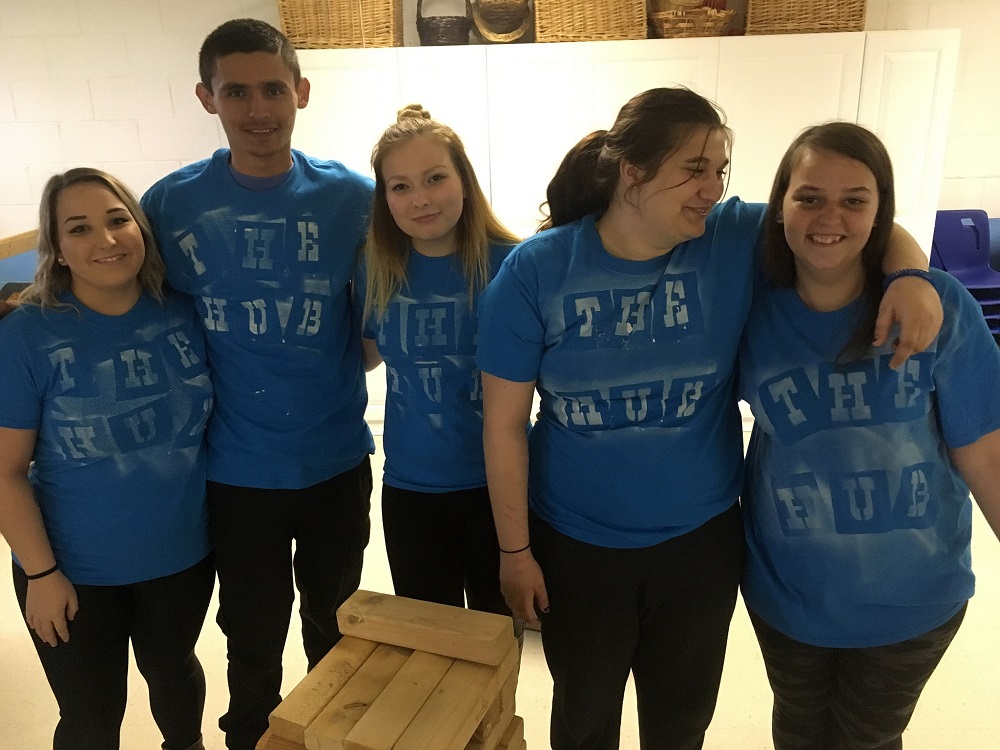 teens in identical blue t-shirts