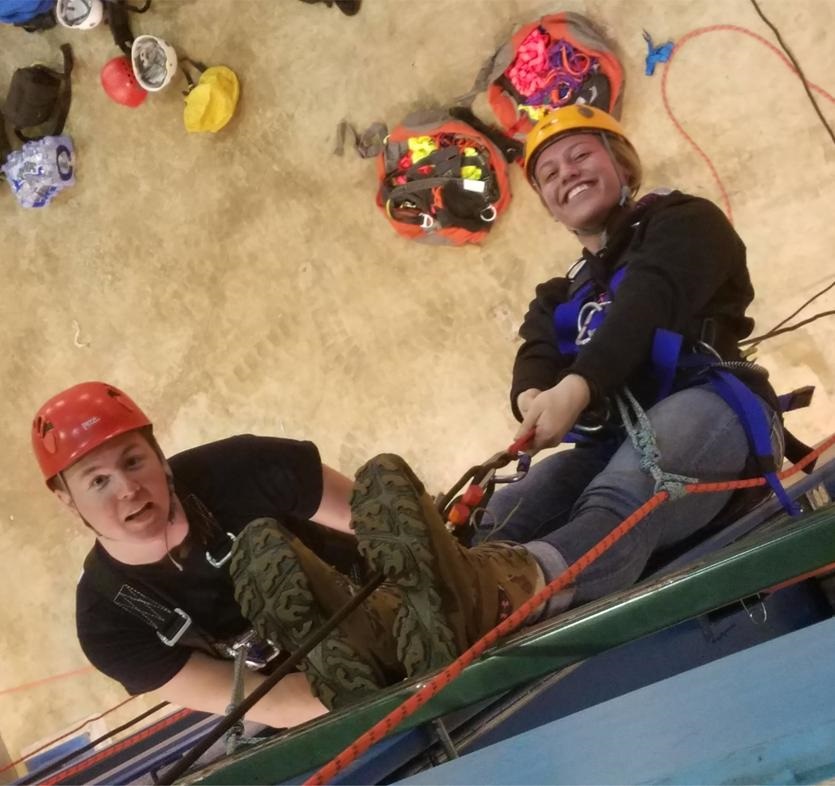 rescue volunteers on climbing wall