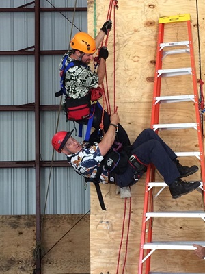 rescue volunteers on climbing wall