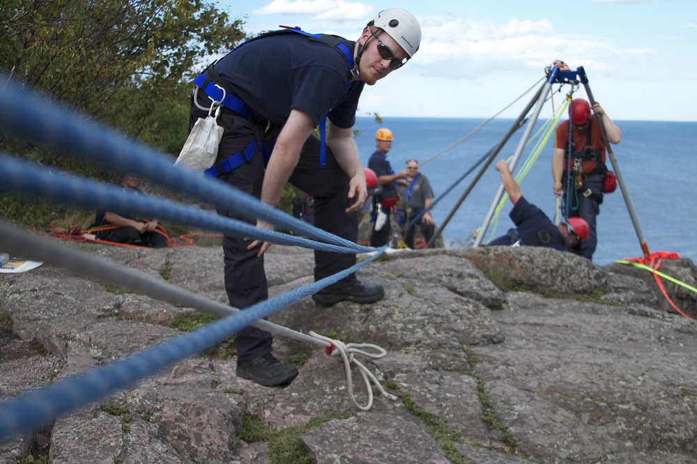 rock climbers with ropes and rigging