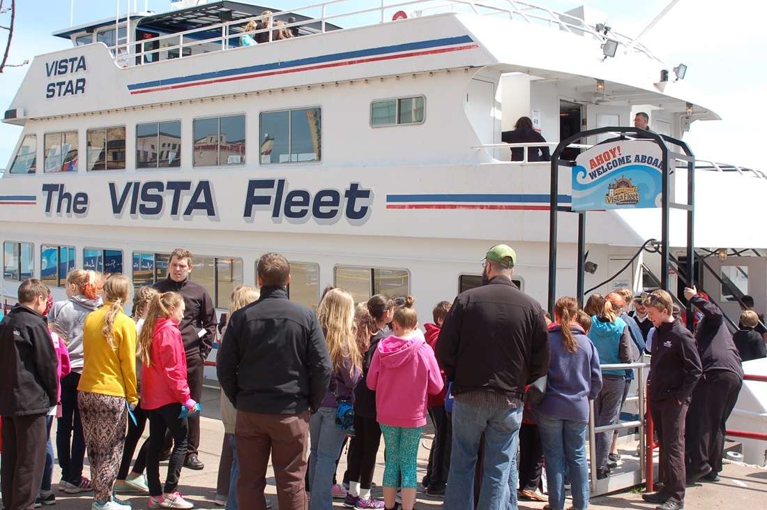 Crowd looking at a boat