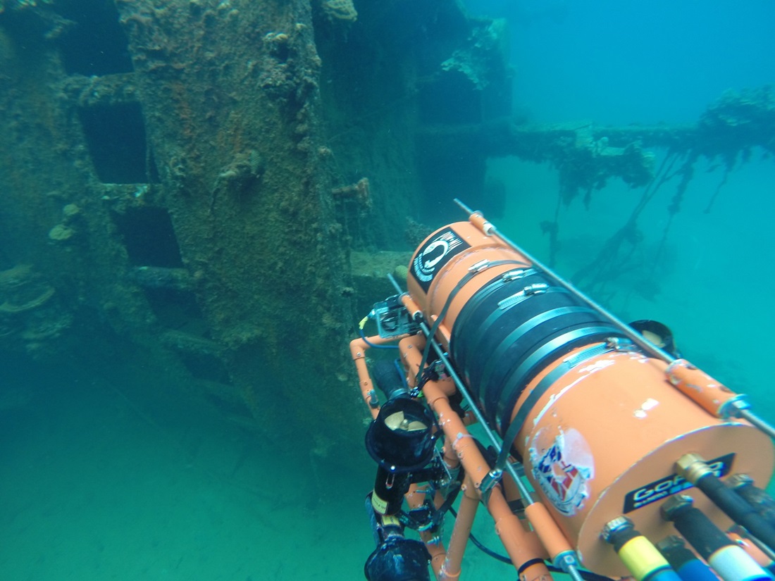 Underwater camera filming sunken plane