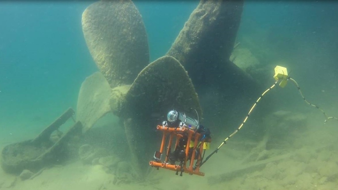 underwater camera filming sunken ship