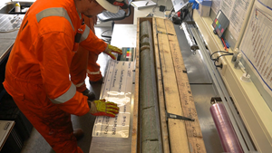 Man studying core sample