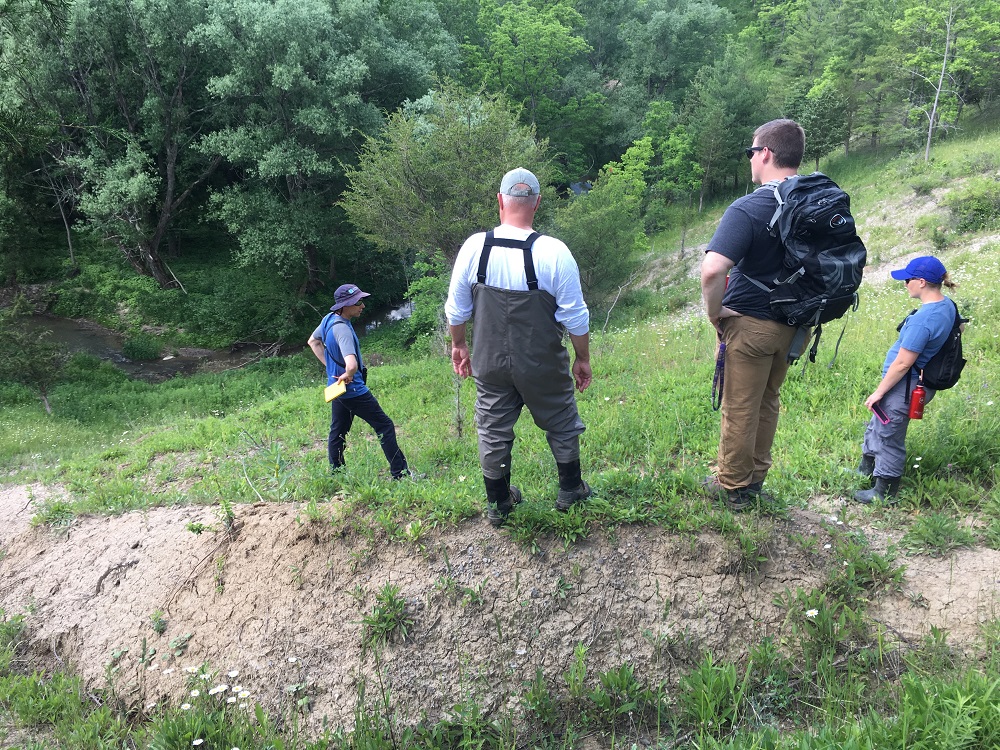 Fishing enthusiasts on a riverbank