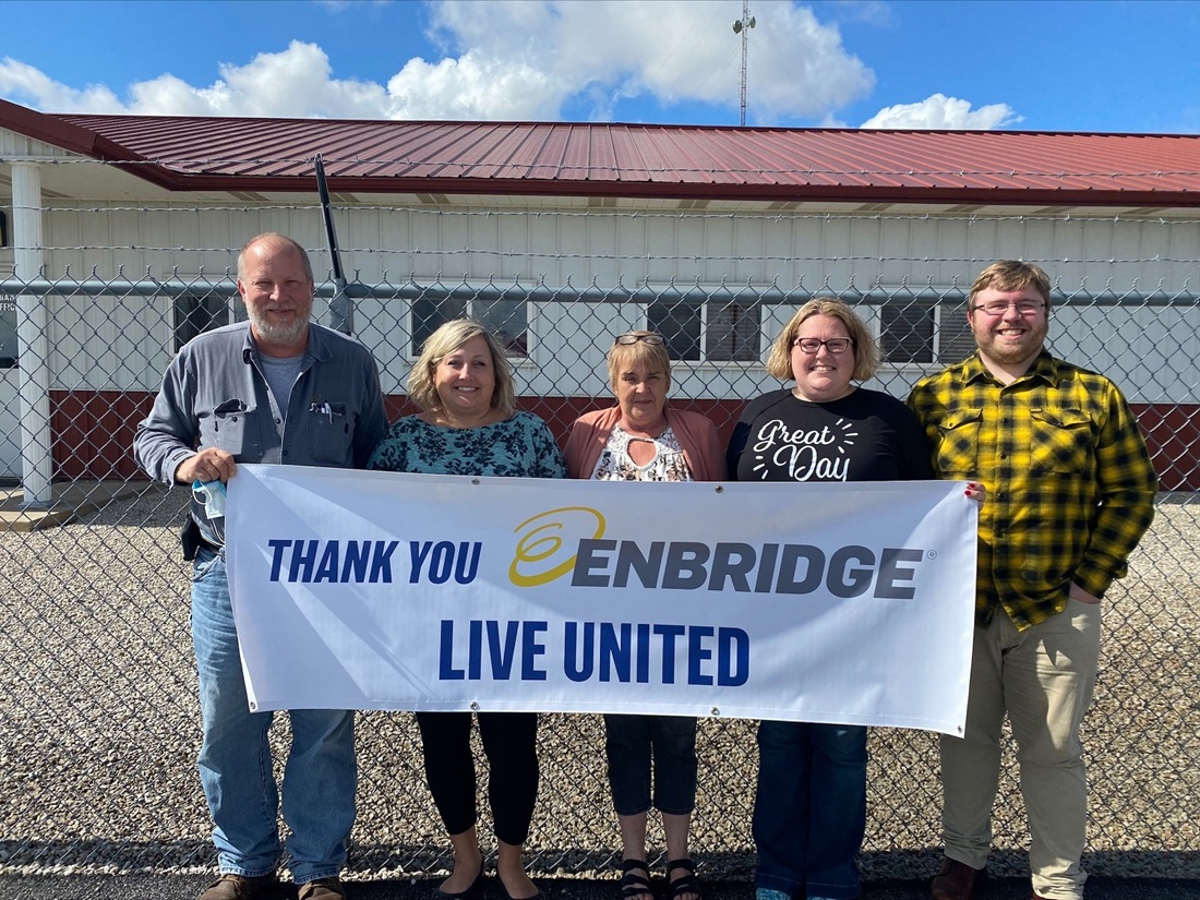 People holding up a United Way sign