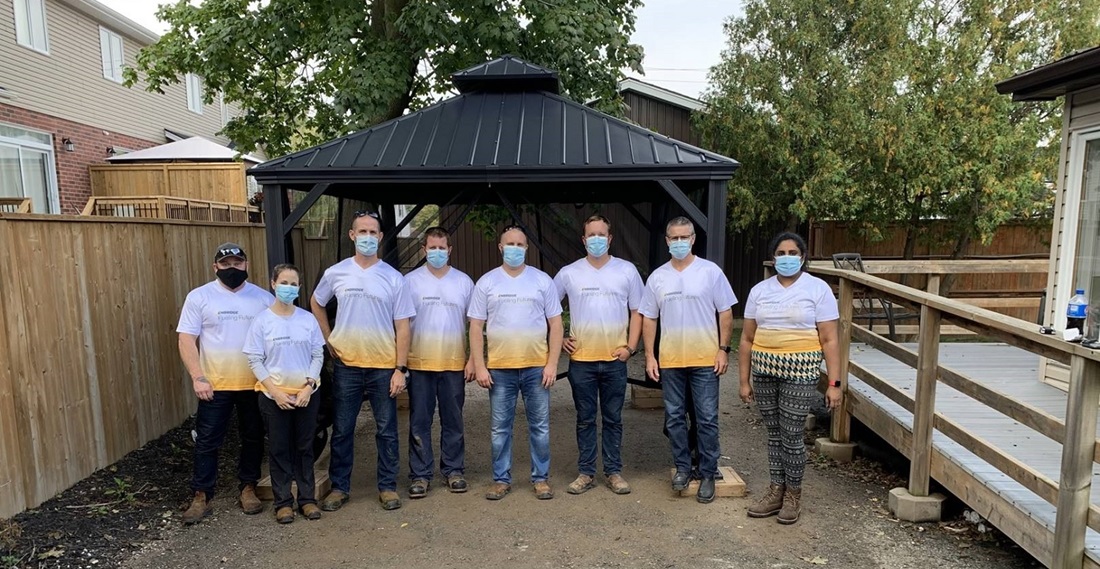 People in front of a pergola