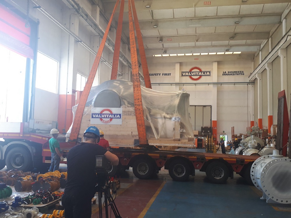 loading giant valve on flatbed truck