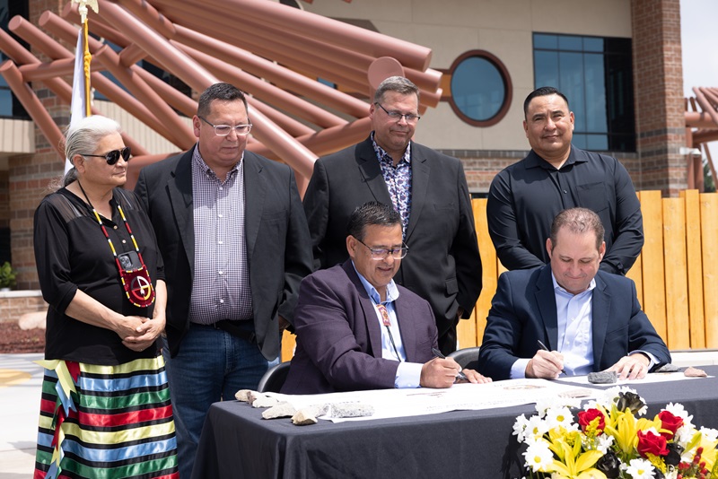 People signing a document