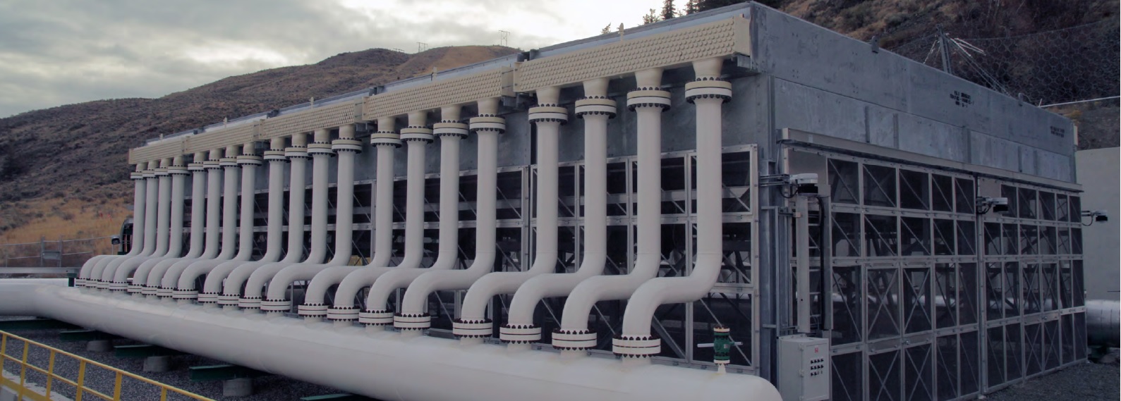 Large building with white pipes on the side