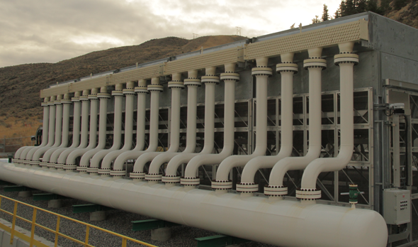 Large building with white vertical pipes