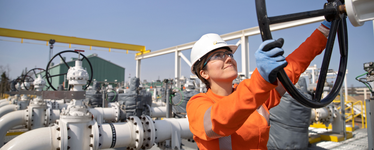 Worker turning a block valve