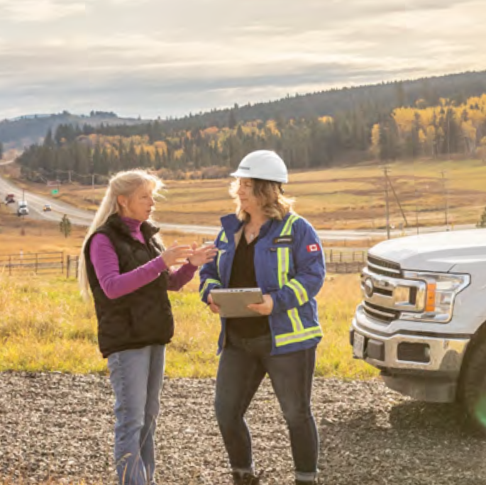 Women beside a truck