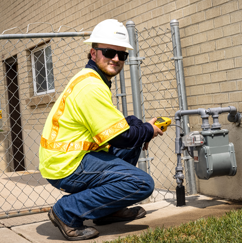 Gas meter reader in safety gear