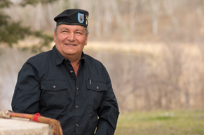 Indigenous man wearing a beret