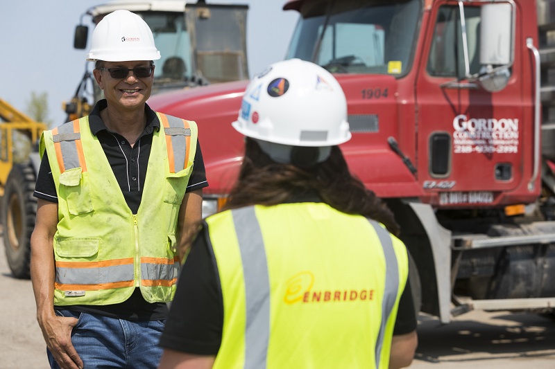 Construction employees talking outside