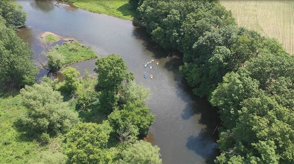 Aerial image of kayakers on a river