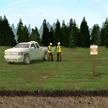 truck workers and pipeline sign