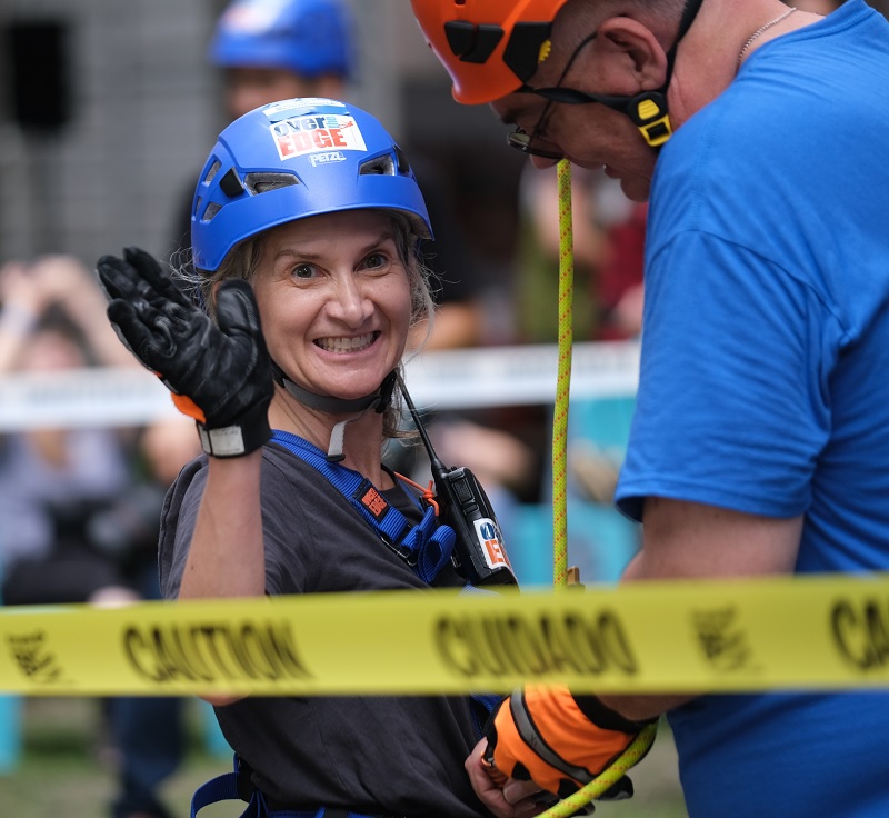 Woman in a blue helmet smiling