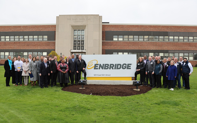 People in front of a sign