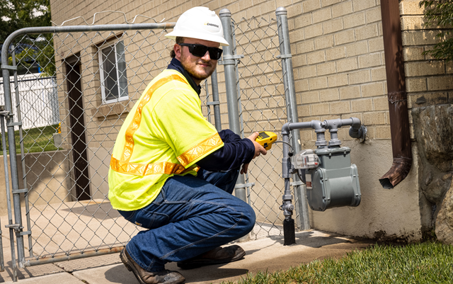 Worker checking a gas meter